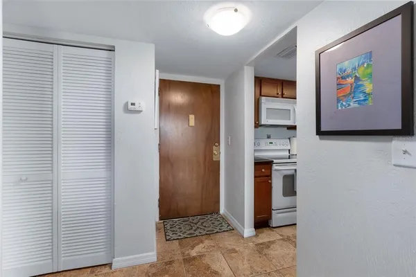 a view of kitchen with stainless steel appliances cabinets and a kitchen view