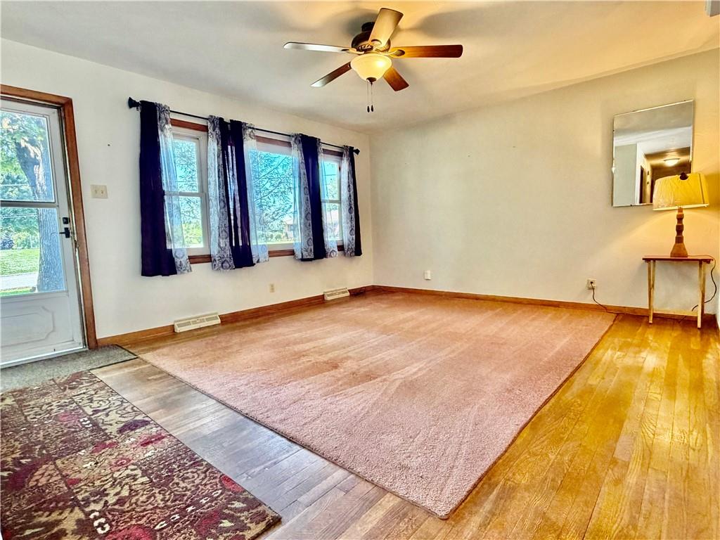 121 Kemar Drive Butler, PA 16002 - Photo 5 of 31 a view of an empty room with window and wooden floor