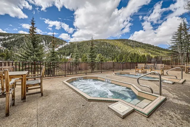 a view of a patio with swimming pool