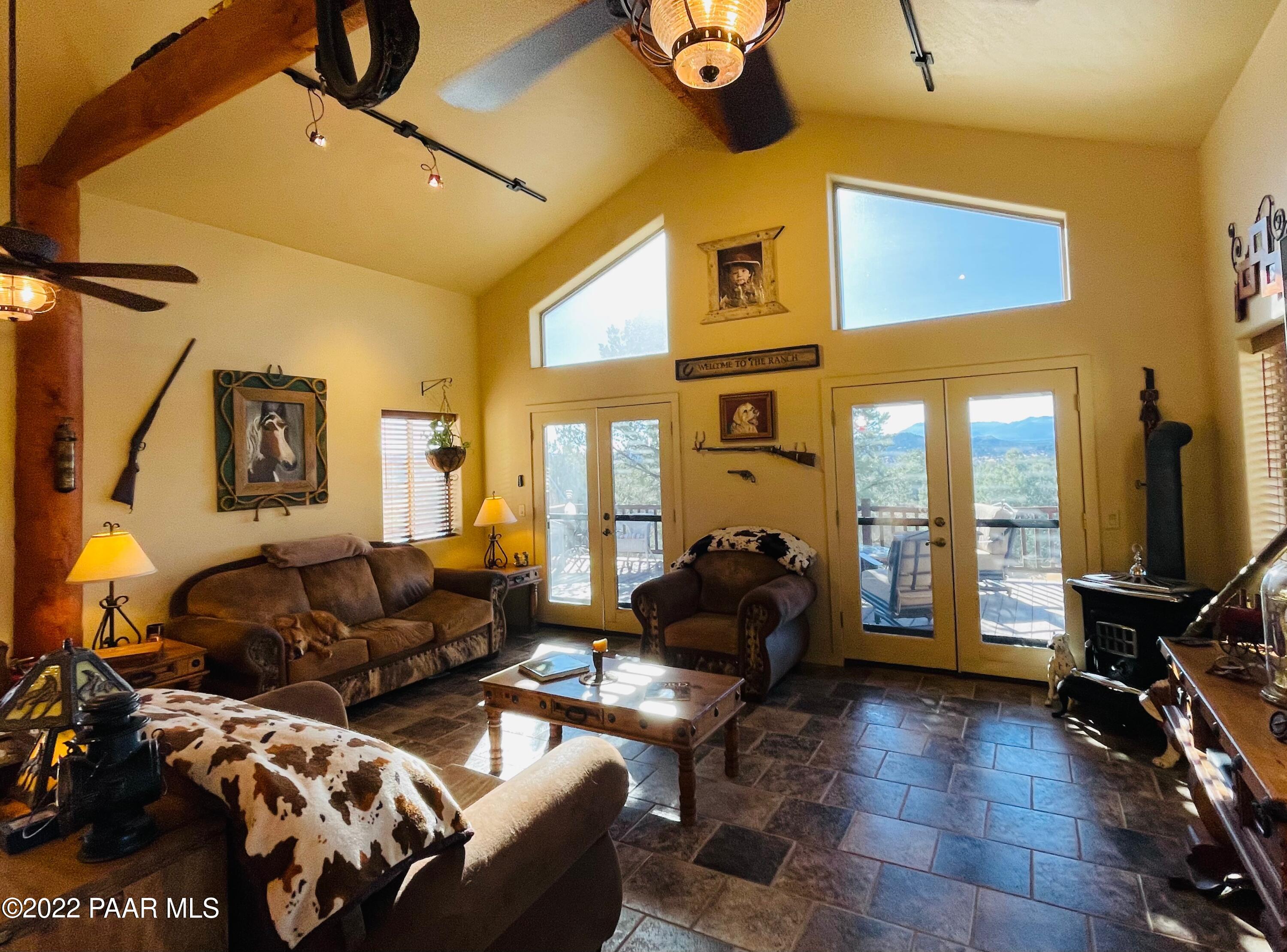 18100 Crossroads Ranch Road Prescott, AZ 86305 - Photo 6 of 40 a living room with furniture and a flat screen tv