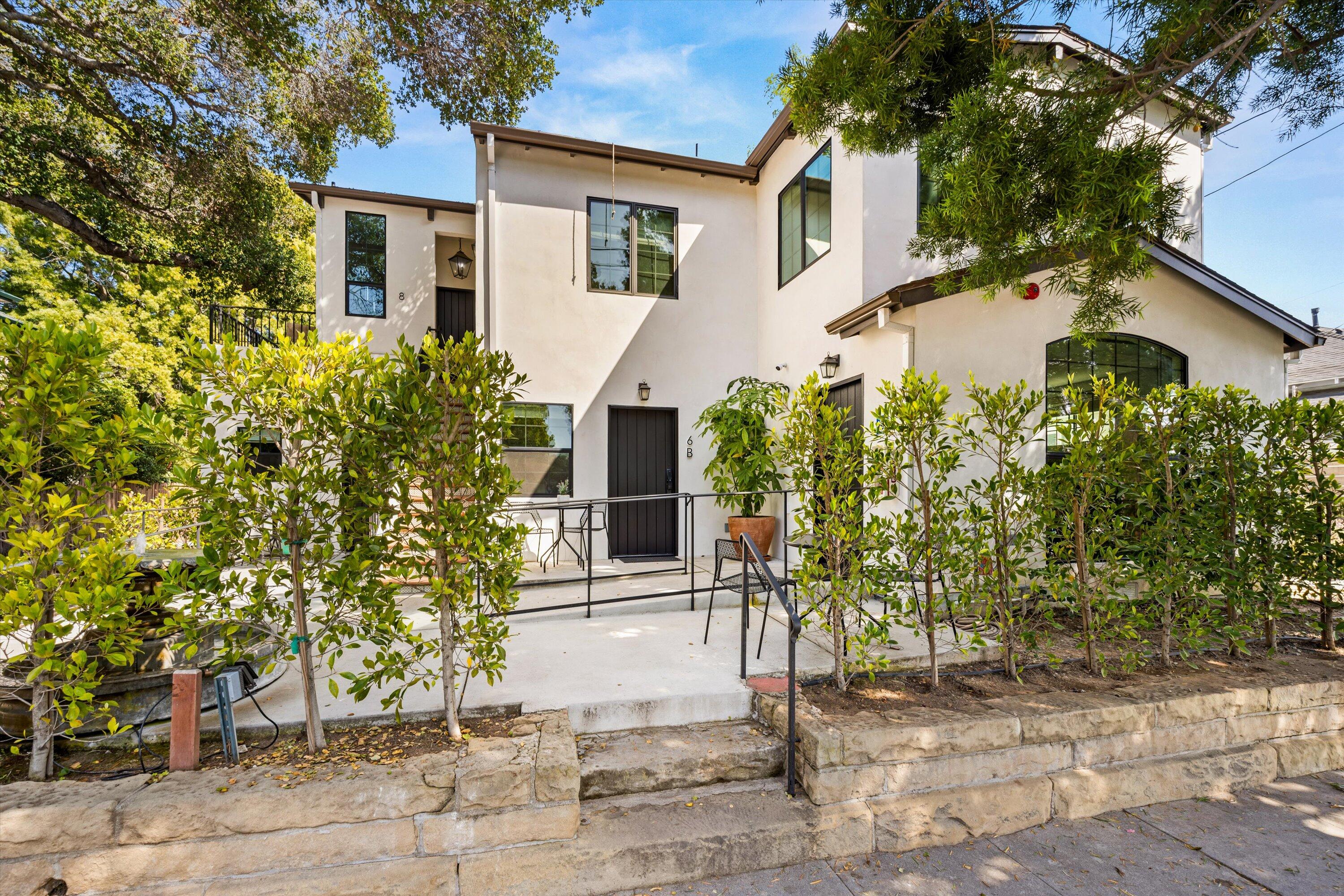 6 East Valerio Street Santa Barbara, CA 93101 - Photo 3 of 74 a front view of a house with garden