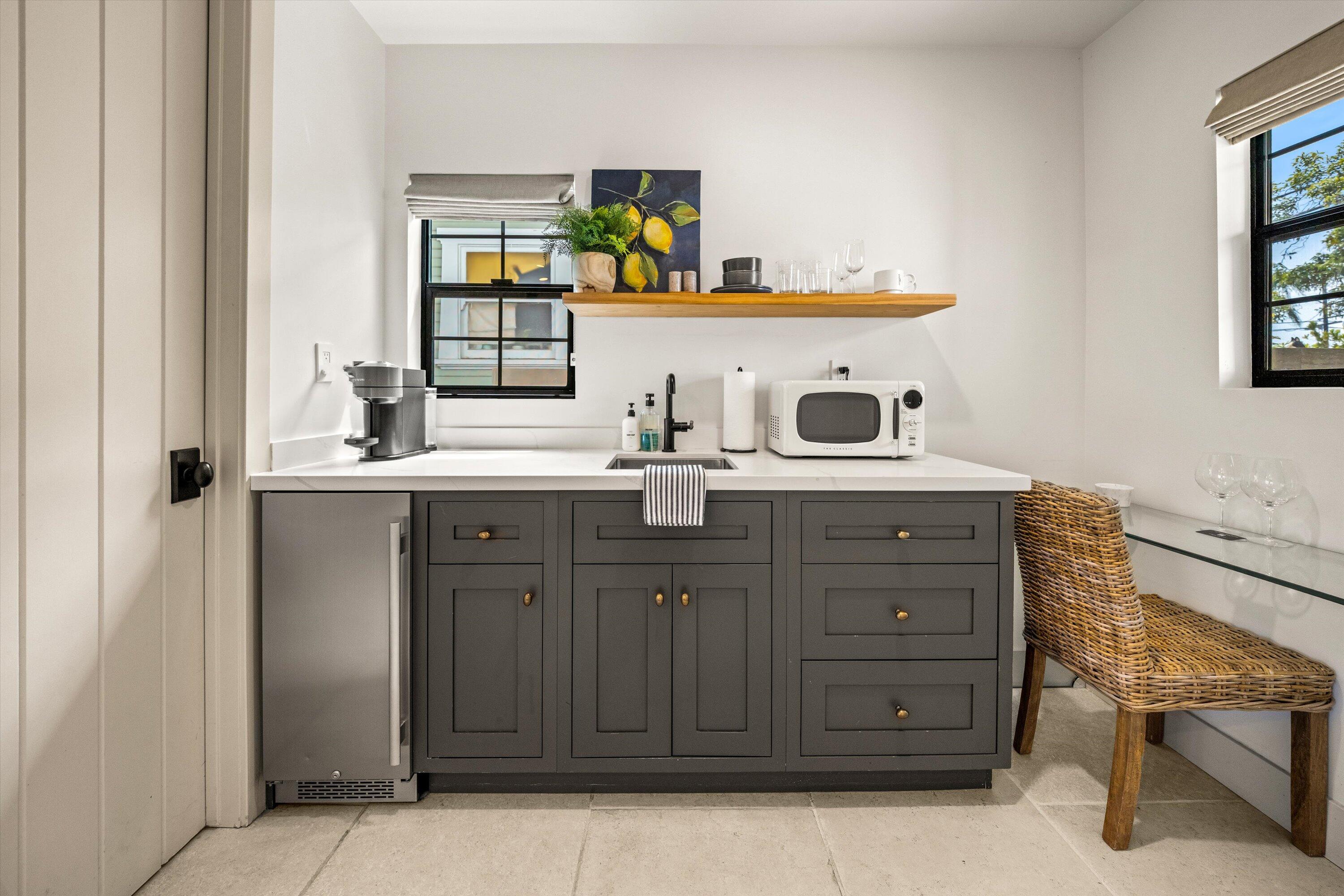 6 East Valerio Street Santa Barbara, CA 93101 - Photo 32 of 74 a kitchen with a sink and cabinets