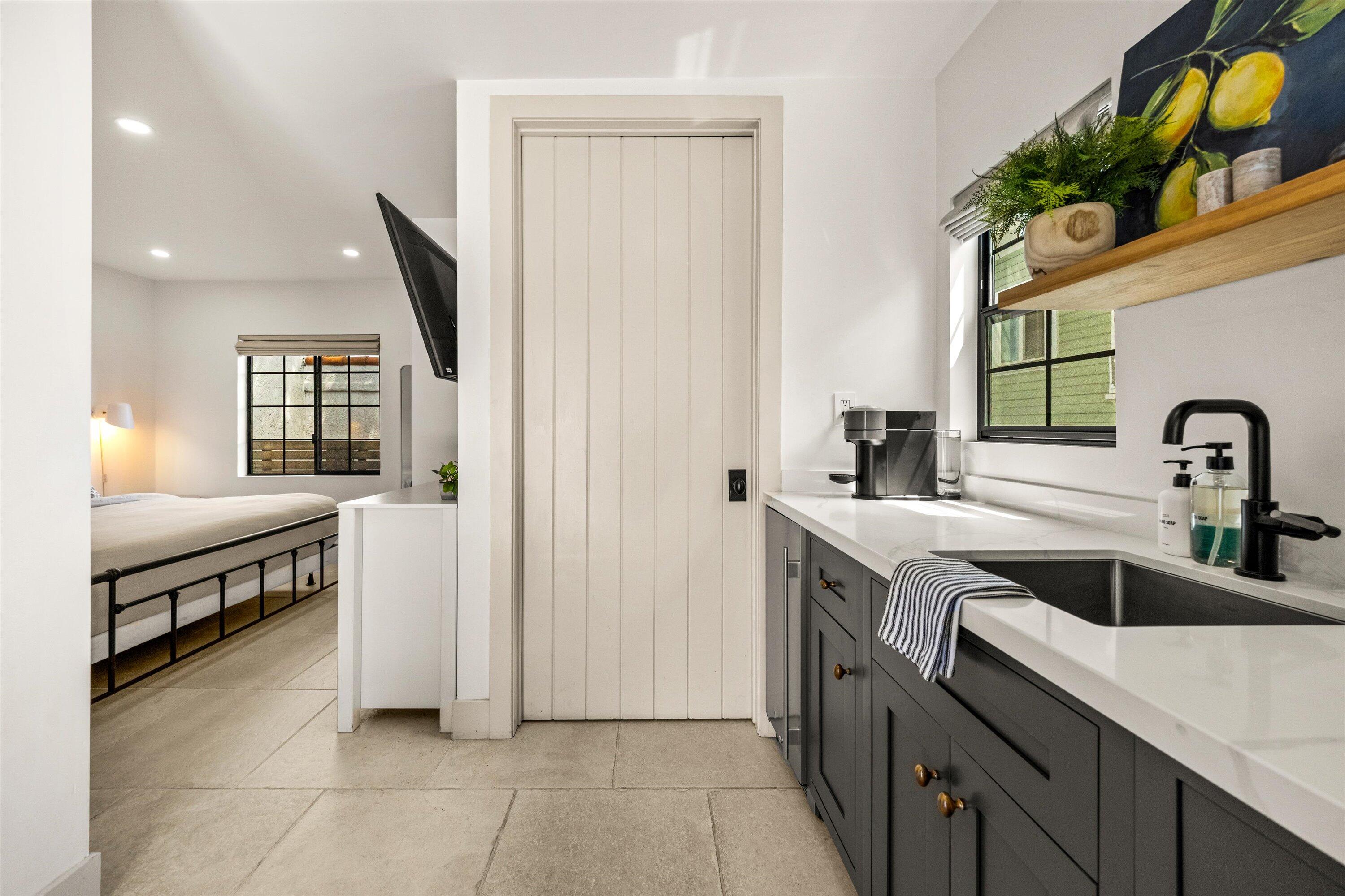 6 East Valerio Street Santa Barbara, CA 93101 - Photo 33 of 74 a kitchen with a sink and a refrigerator
