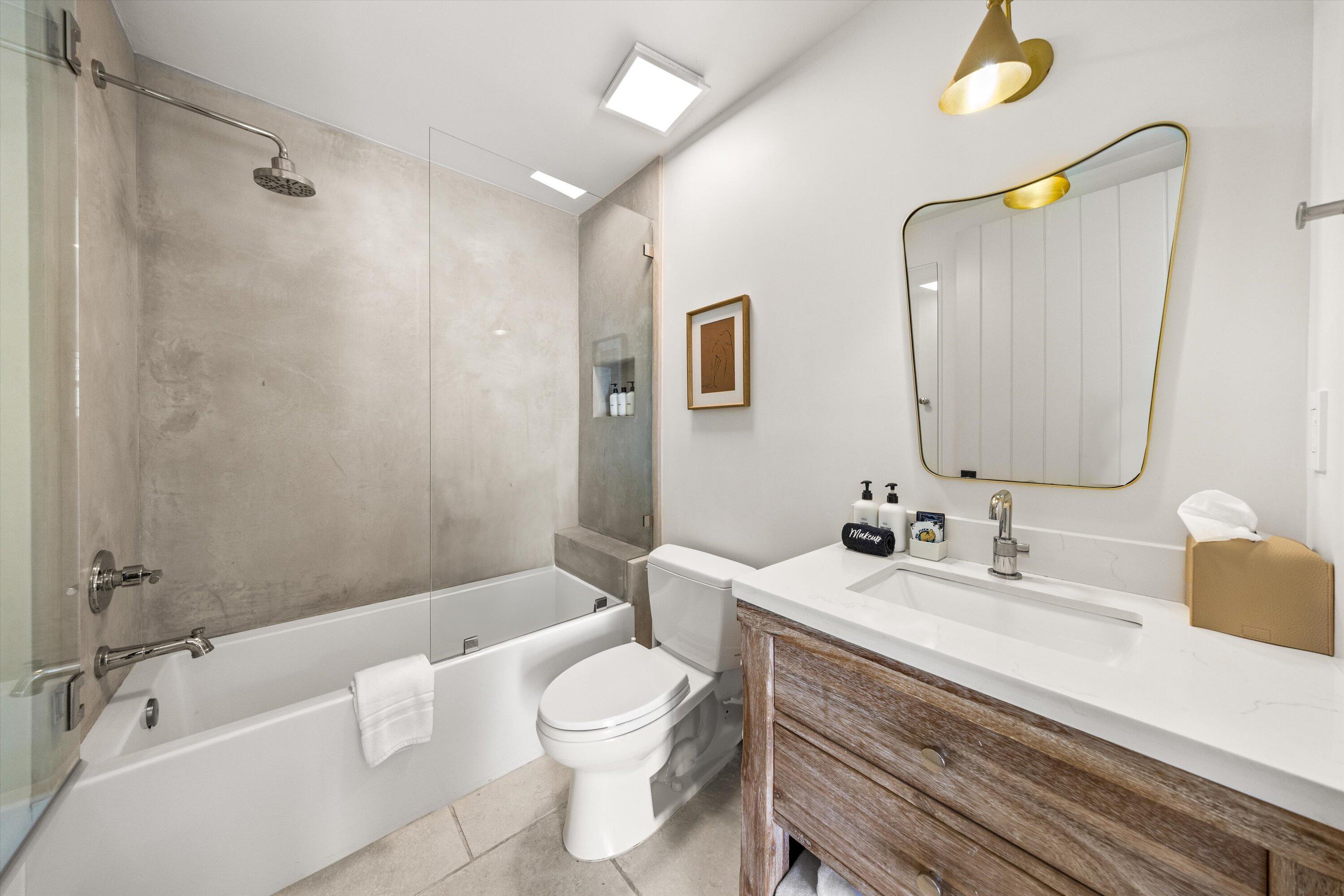 6 East Valerio Street Santa Barbara, CA 93101 - Photo 34 of 74 a bathroom with a sink a toilet and shower