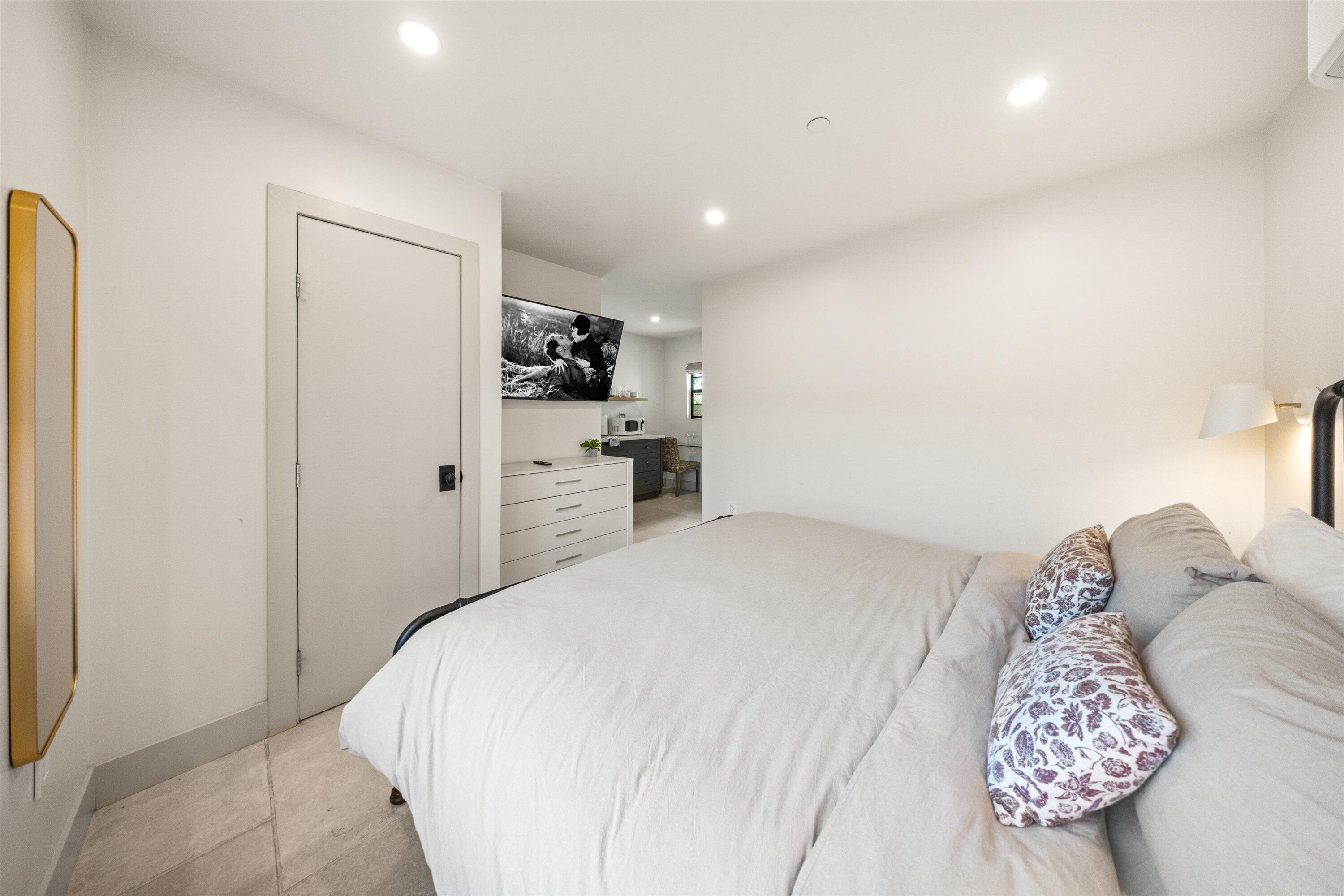 6 East Valerio Street Santa Barbara, CA 93101 - Photo 37 of 74 a bedroom with a large bed and a window