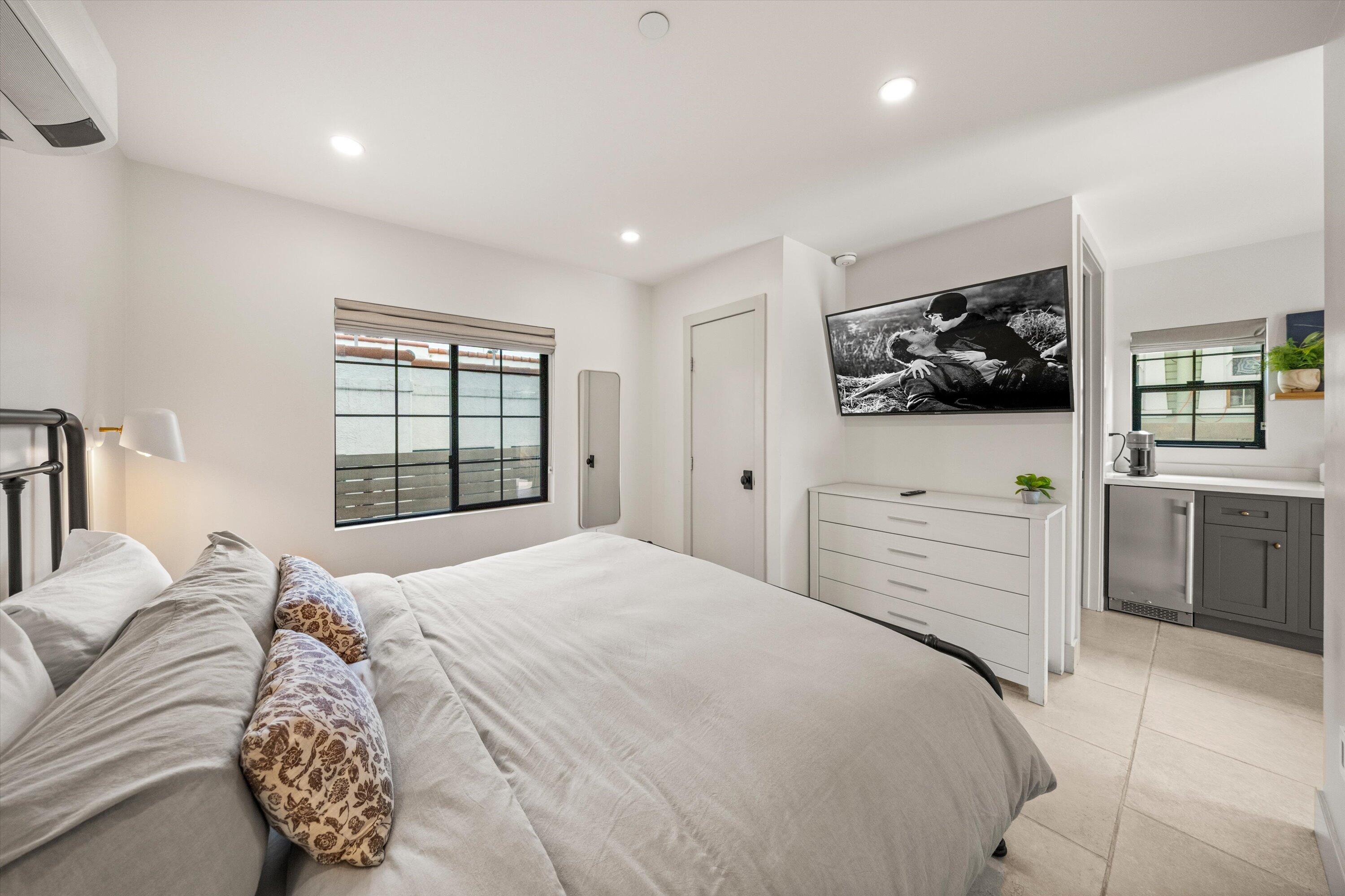 6 East Valerio Street Santa Barbara, CA 93101 - Photo 38 of 74 a bedroom with a bed and a flat screen tv