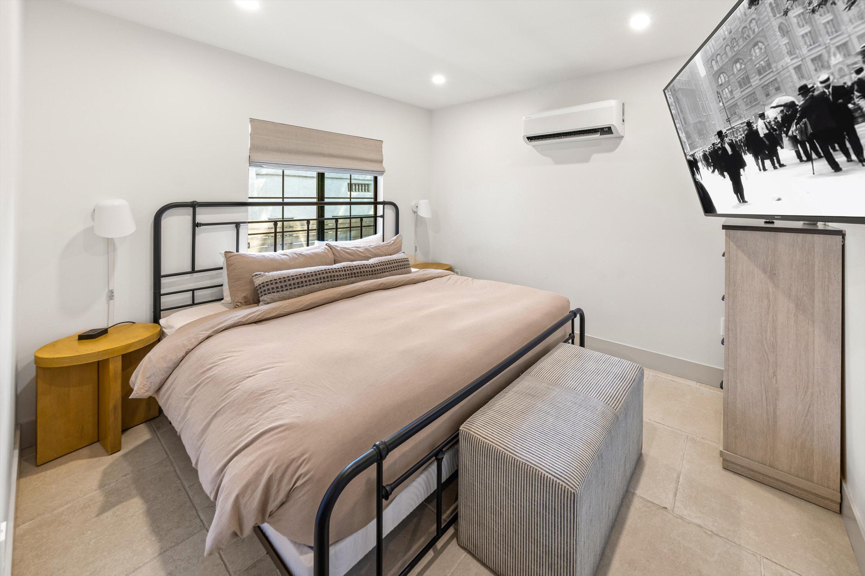 6 East Valerio Street Santa Barbara, CA 93101 - Photo 10 of 74 a bedroom with a bed and a painting on the wall