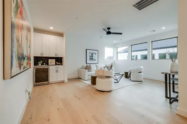 a bedroom with a bed and a night stand