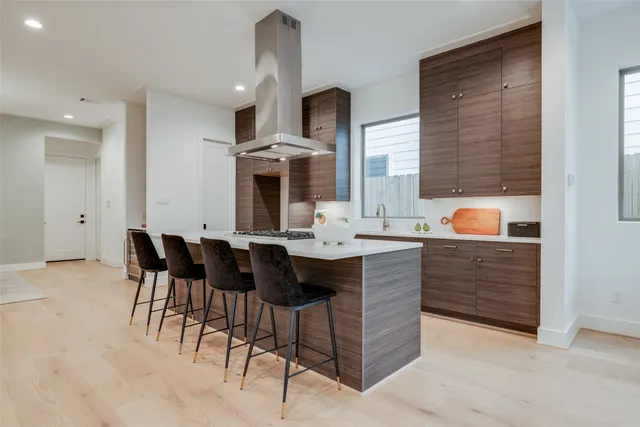a kitchen with a stove and a chandelier