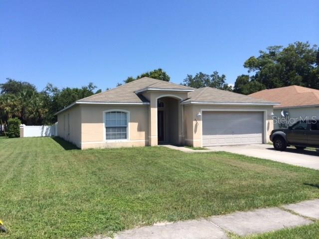5331 Linder Place New Port Richey, FL 34652 - Photo 1 of 1 a front view of a house with a yard and garage