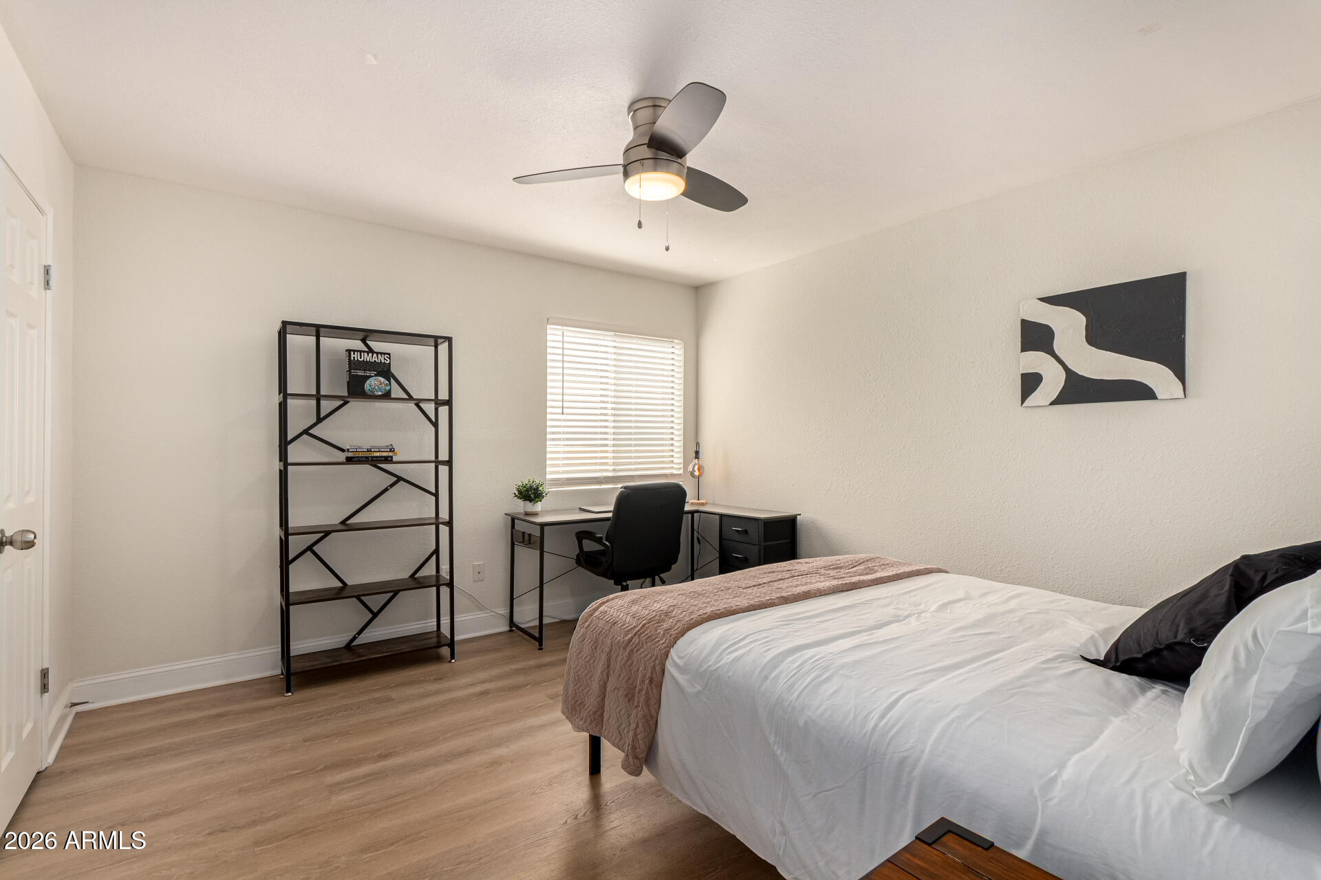 5877 North Granite Reef Road, Unit 1133 Scottsdale, AZ 85250 - Photo 15 of 33 a bedroom with a bed and a window