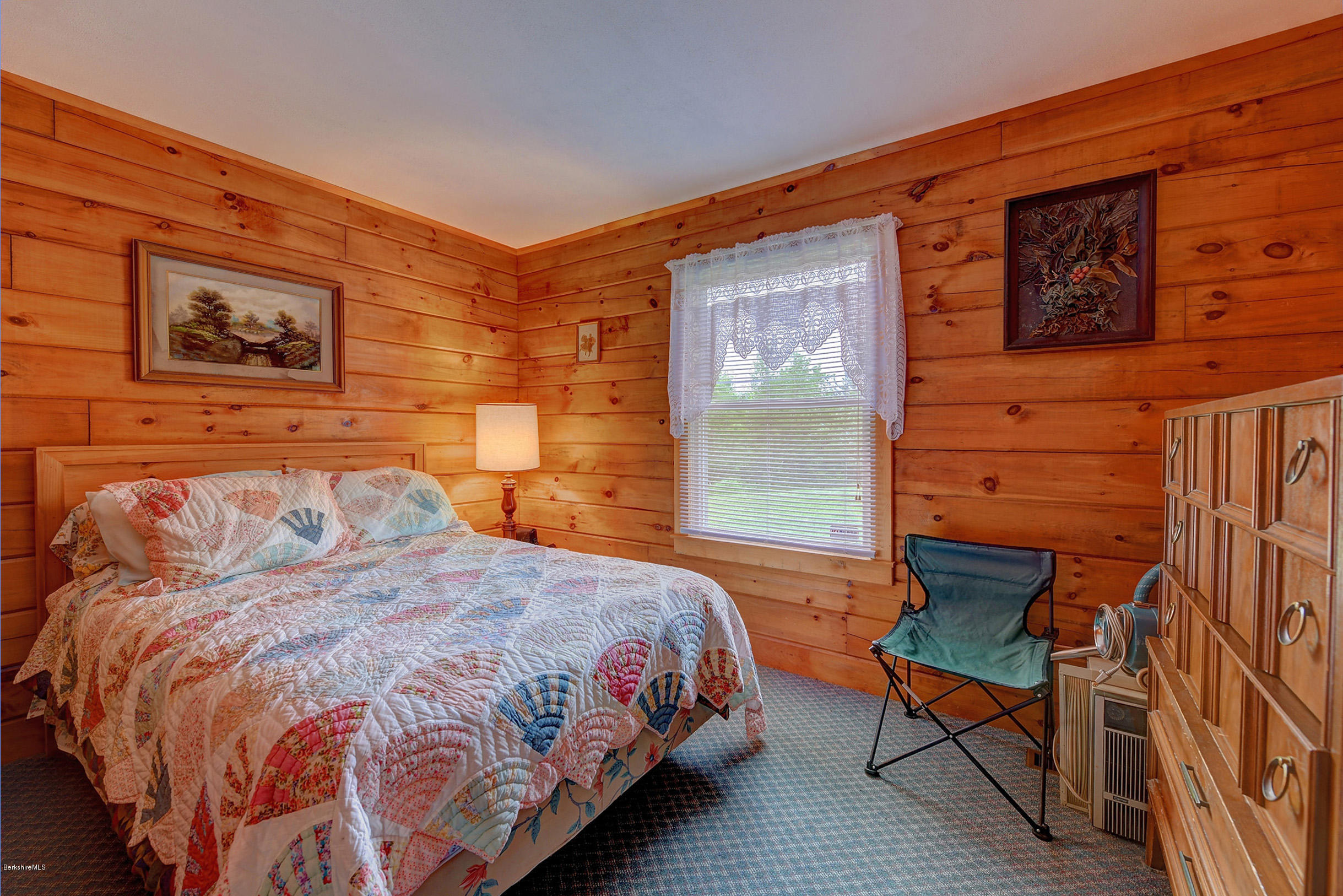 92 Curtin Road Peru, MA 01235 - Photo 22 of 30 a bedroom with a bed and wooden floor