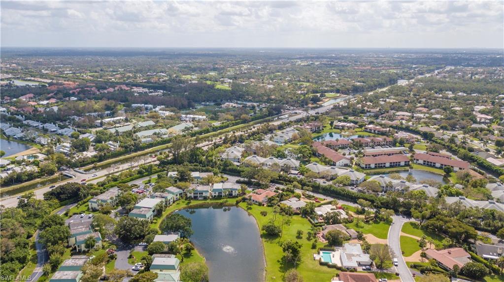 217 Bobolink Way, Unit 217B Naples, FL 34105 - Photo 16 of 17 an aerial view of a city with lots of residential buildings