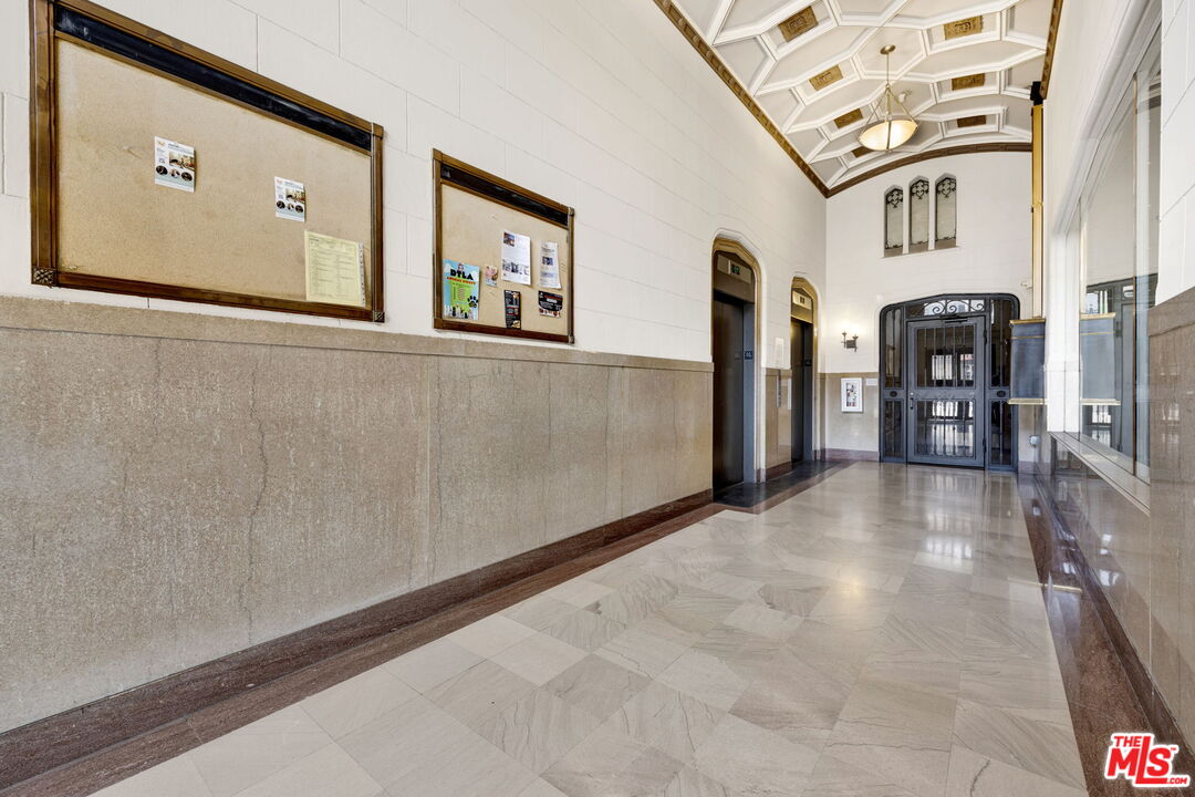 315 East 8th Street, Unit 1102 Los Angeles, CA 90014 - Photo 24 of 34 a view of a hallway with paintings on the wall
