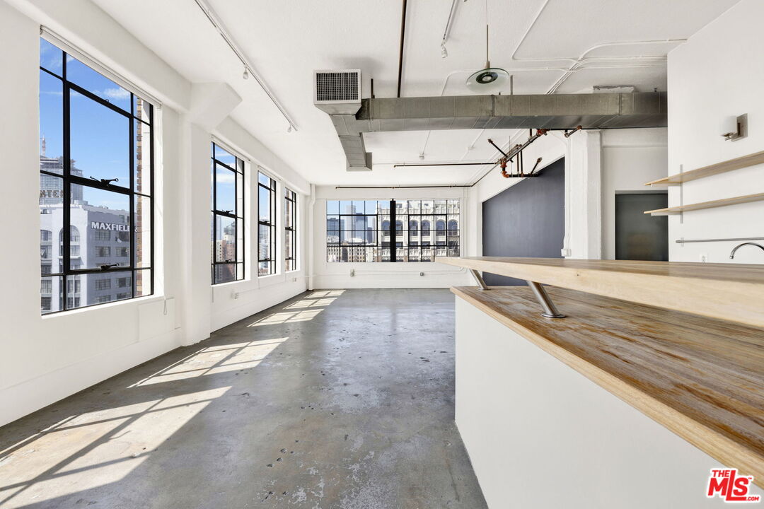 315 East 8th Street, Unit 1102 Los Angeles, CA 90014 - Photo 8 of 34 a view of a living room with a large window