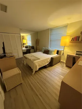 a bedroom with two beds and painted walls