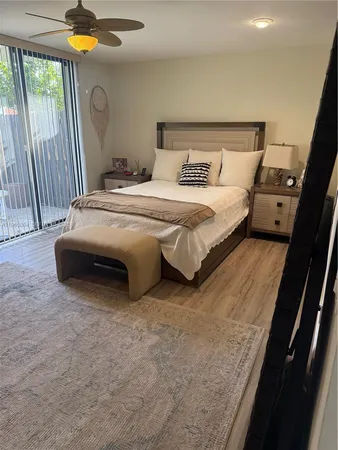 a bedroom with bed and window