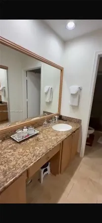a view of a sink and a mirror