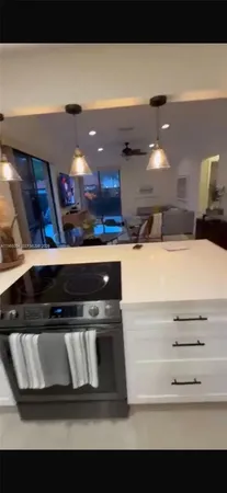 a view of stove top oven with cabinets