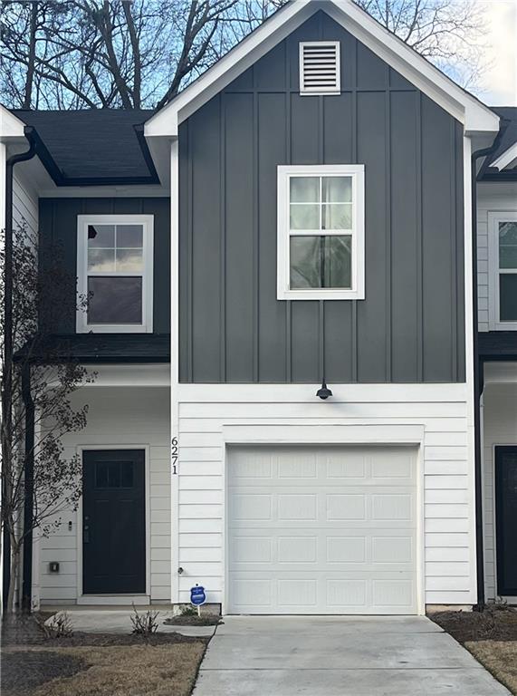 a front view of a house with garage