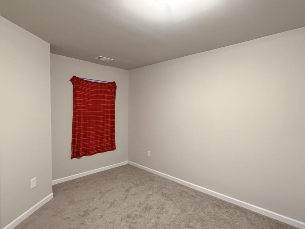 6271 Redan Square, Unit 83 Lithonia, GA 30058 - Photo 3 of 10 an empty room with windows