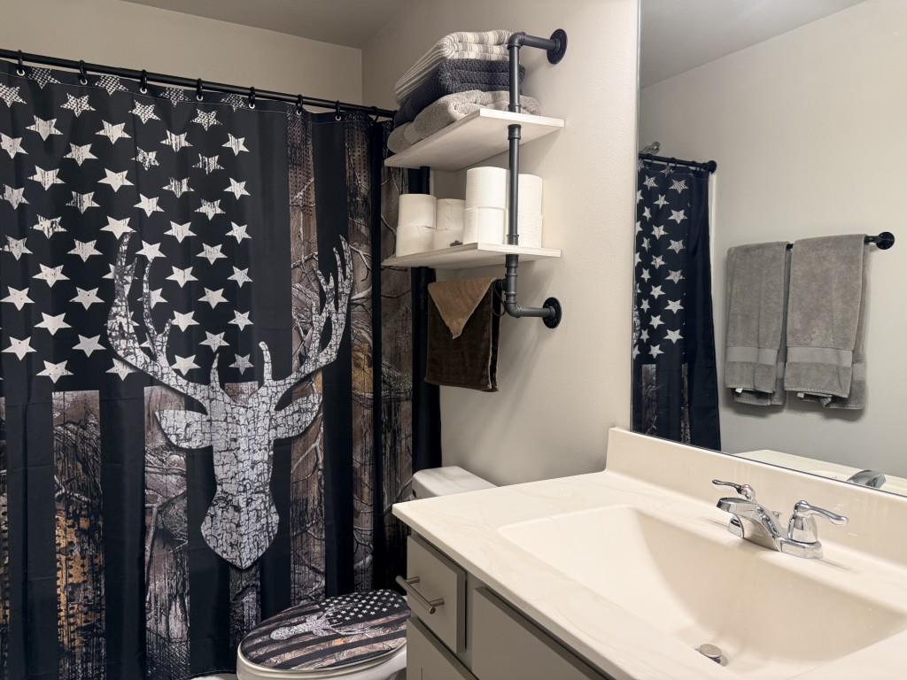 6271 Redan Square, Unit 83 Lithonia, GA 30058 - Photo 5 of 10 a bathroom with a sink and a mirror