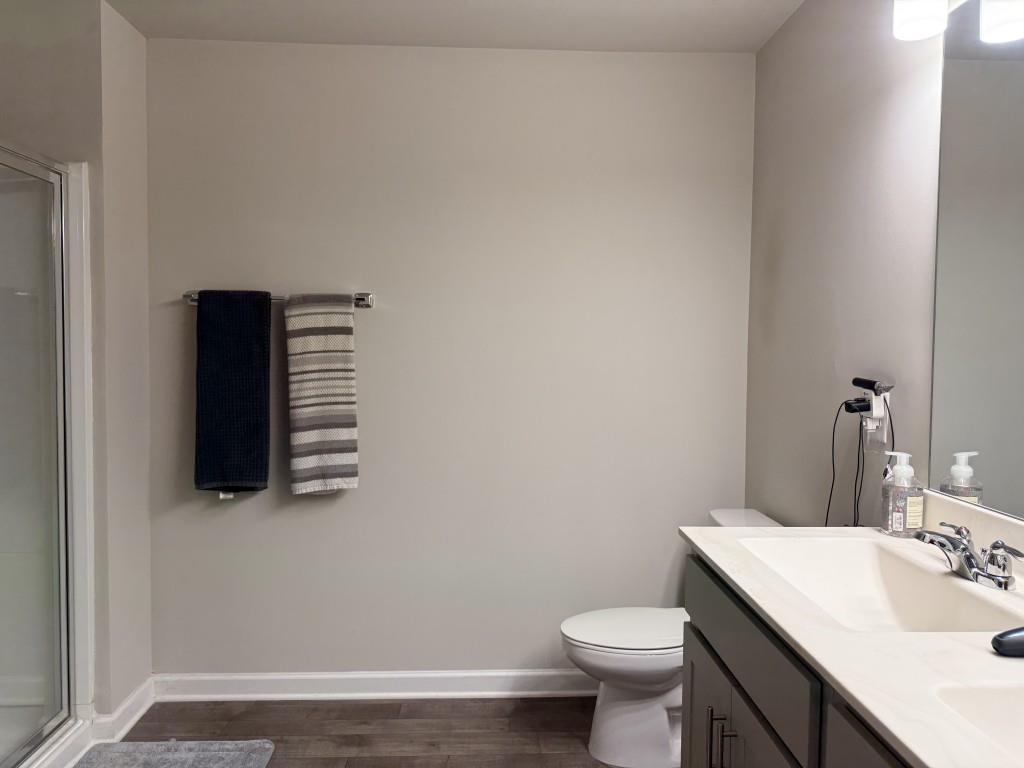 6271 Redan Square, Unit 83 Lithonia, GA 30058 - Photo 6 of 10 a bathroom with a sink toilet and mirror