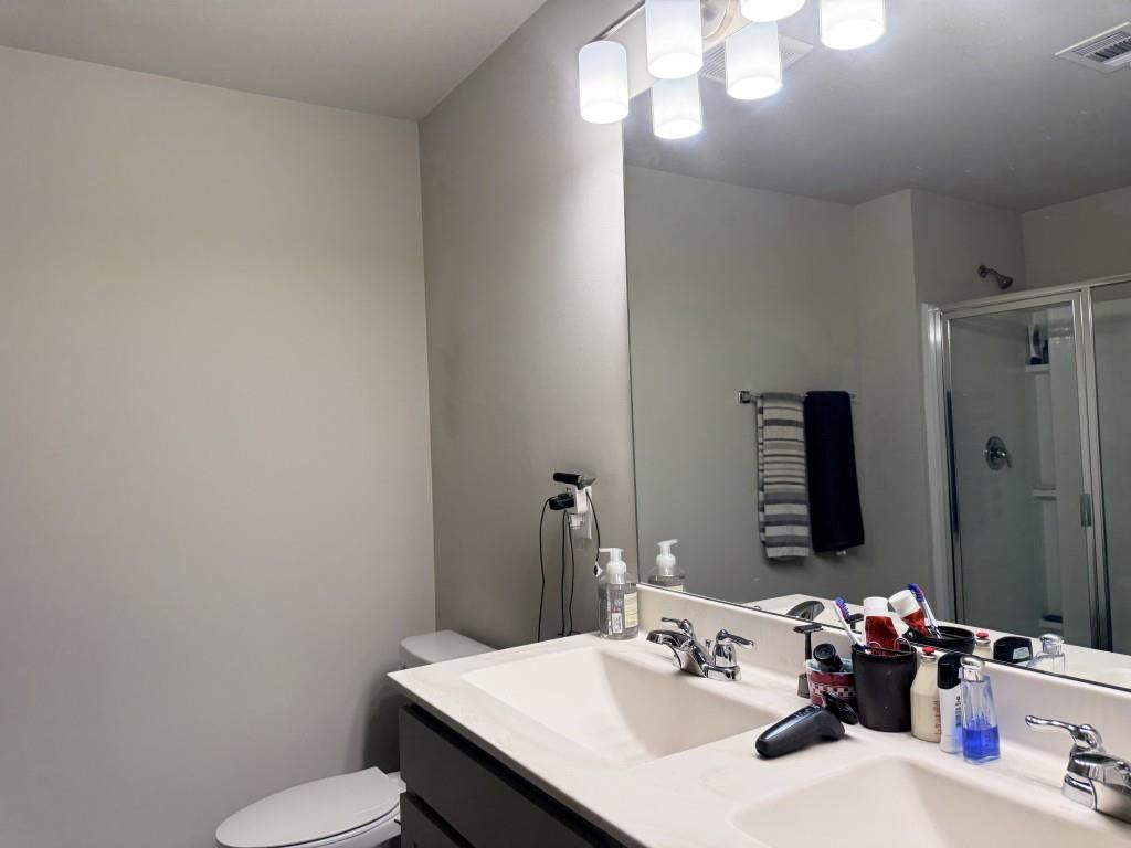 6271 Redan Square, Unit 83 Lithonia, GA 30058 - Photo 7 of 10 a bathroom with a sink vanity mirror and toilet