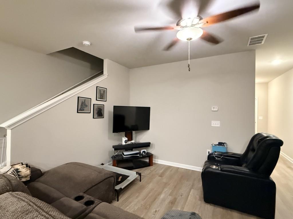 6271 Redan Square, Unit 83 Lithonia, GA 30058 - Photo 10 of 10 a living room with furniture and a flat screen tv