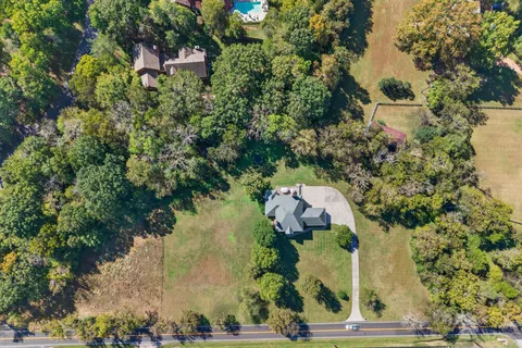 an aerial view of house with yard