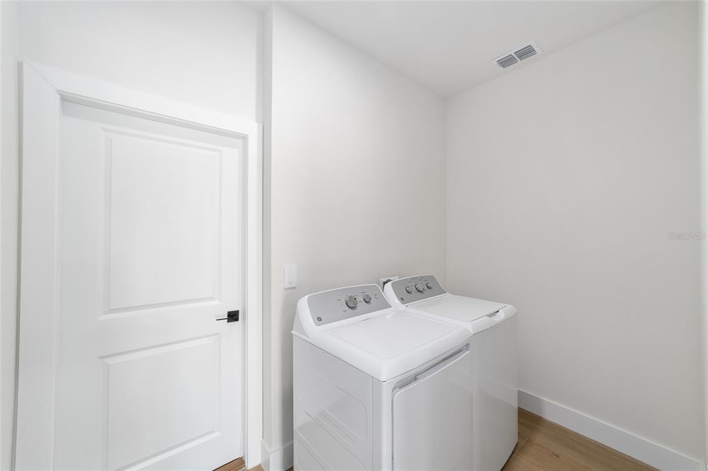 4380 Southwest 159th Court Ocala, FL 34481 - Photo 33 of 44 a utility room with dryer and washer