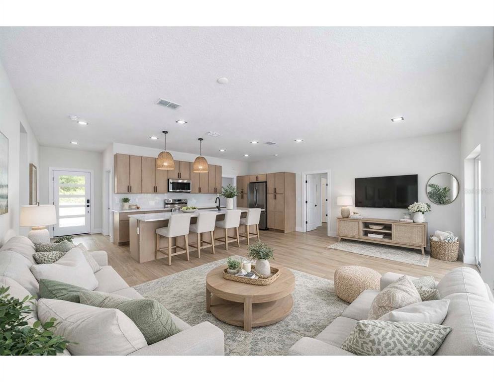 4380 Southwest 159th Court Ocala, FL 34481 - Photo 8 of 44 a living room with furniture and a flat screen tv