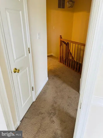 a white toilet sitting next to a sink