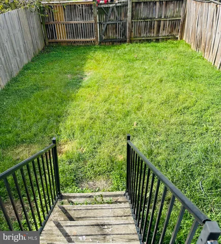 a view of a house with a balcony and stairs