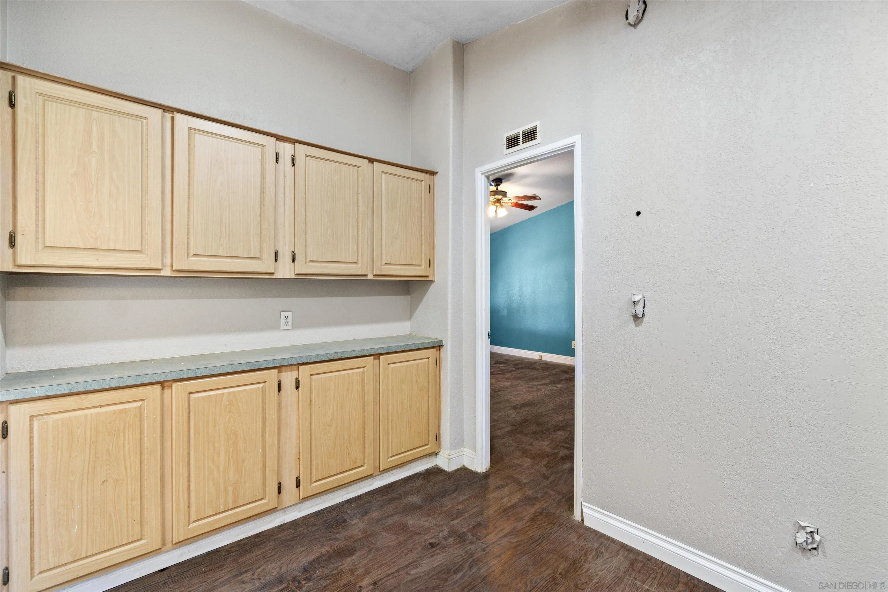 5631 Alpine Boulevard Alpine, CA 91901 - Photo 12 of 20 a kitchen with granite countertop white cabinets and a sink