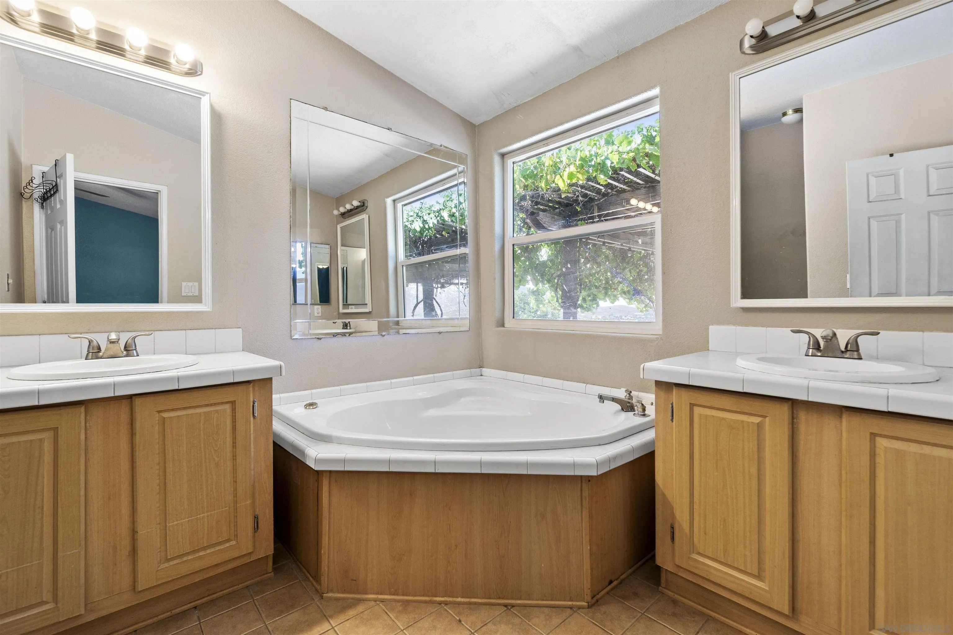 5631 Alpine Boulevard Alpine, CA 91901 - Photo 15 of 20 a bathroom with a sink and a bathtub