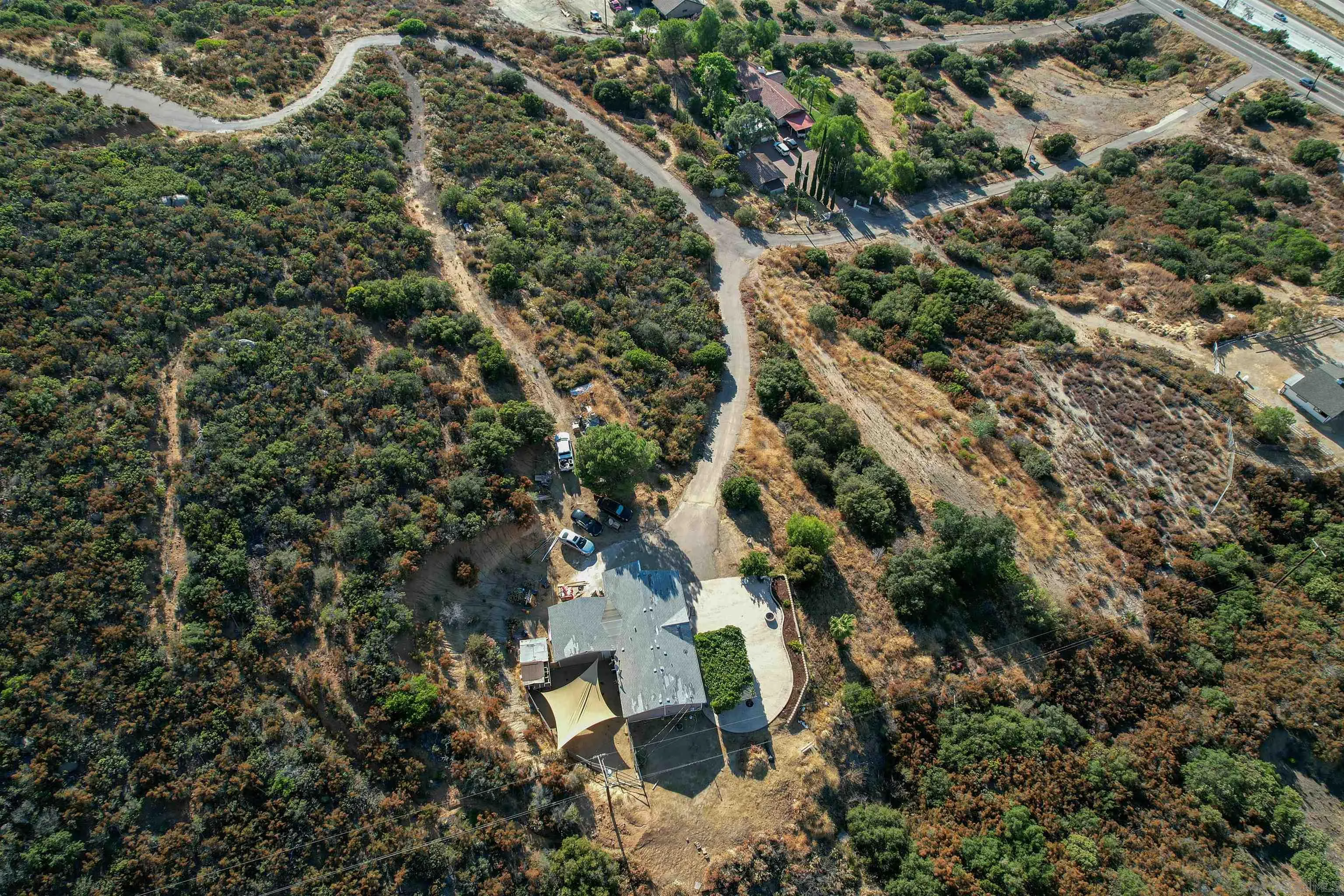 5631 Alpine Boulevard Alpine, CA 91901 - Photo 4 of 20 an aerial view of residential house with outdoor space and trees all around