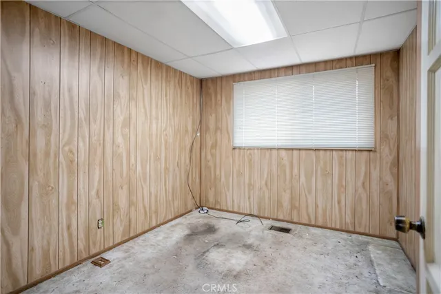 an empty room with a wooden door