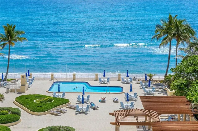 a view of a swimming pool with a lounge chair