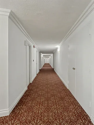 a view of a hallway to a bedroom