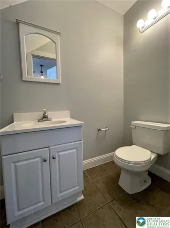 a bathroom with a sink toilet and vanity