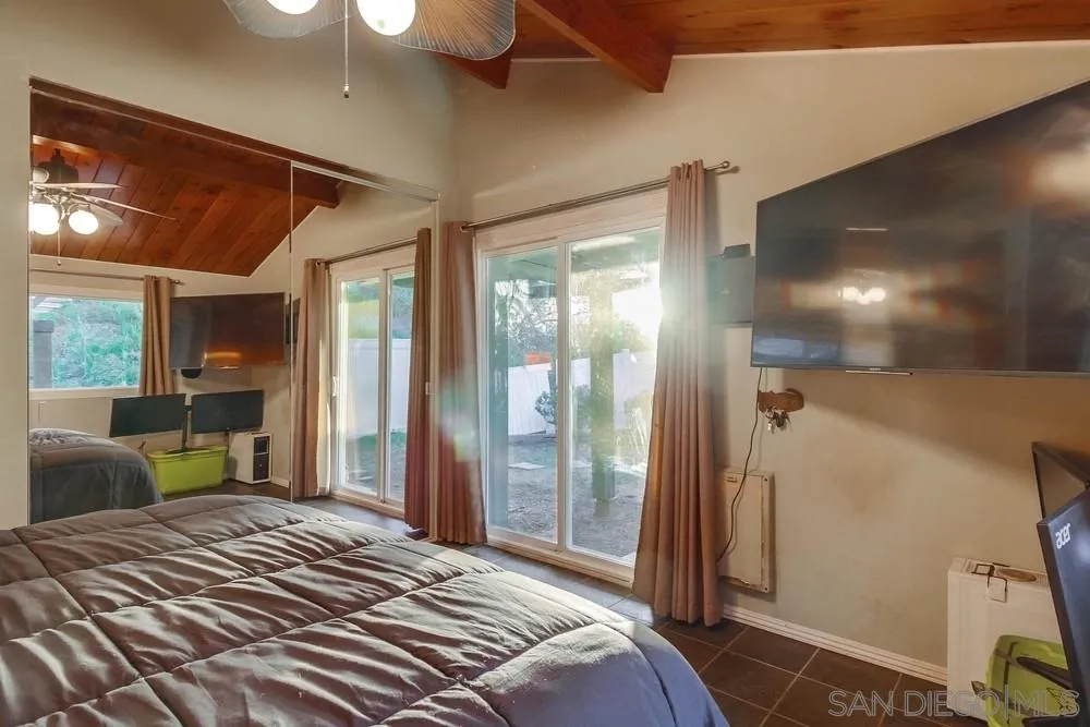 2010 South Grade Road Alpine, CA 91901 - Photo 21 of 35 a bedroom with a bed and glass door
