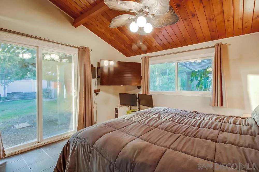 2010 South Grade Road Alpine, CA 91901 - Photo 22 of 35 a bedroom with a large bed and a balcony
