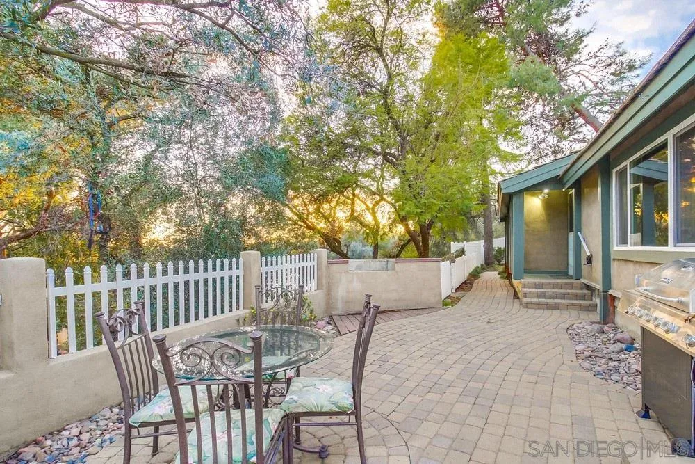 2010 South Grade Road Alpine, CA 91901 - Photo 3 of 35 a view of a patio with table and chairs and wooden fence