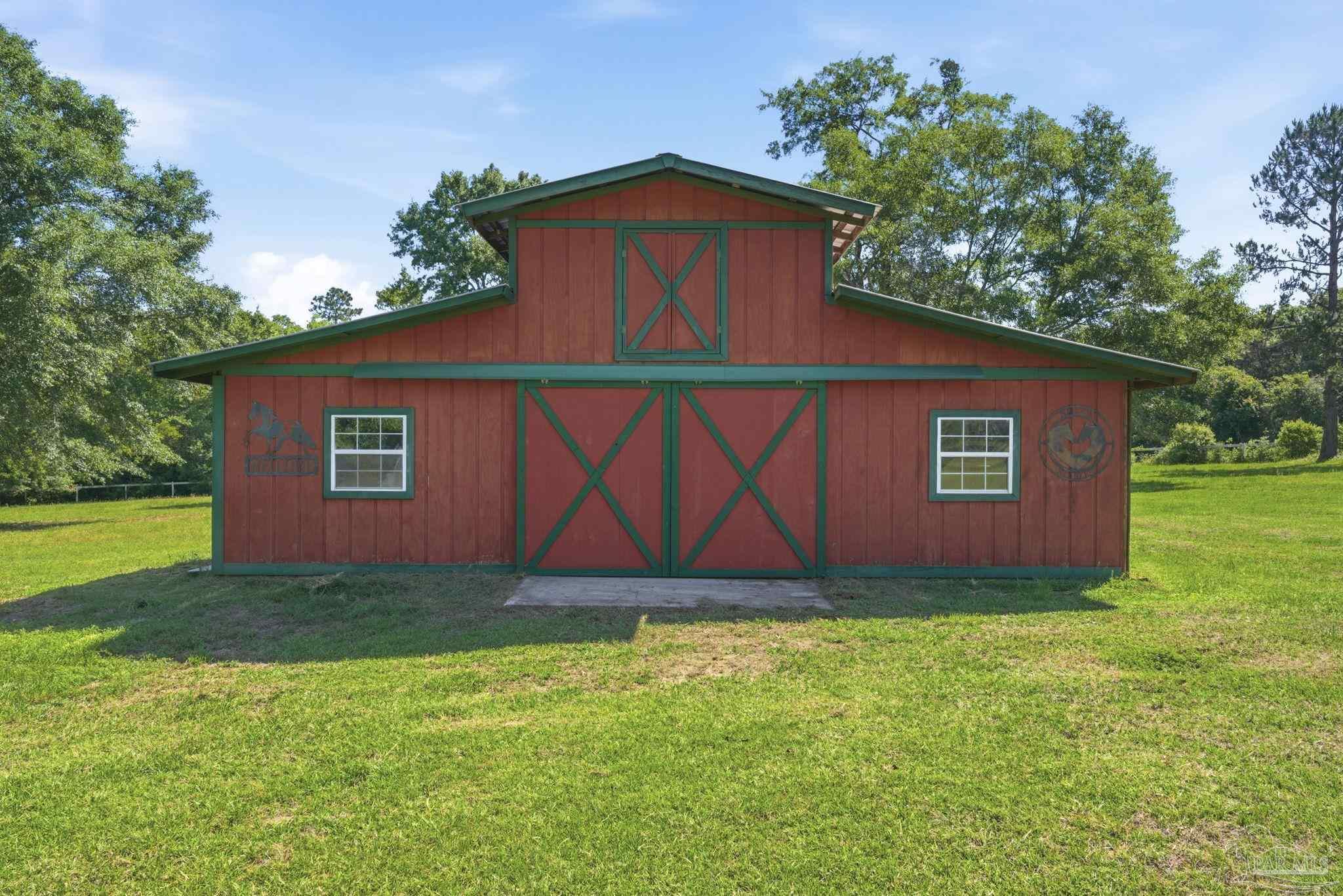 6870 Martin Road Milton, FL 32570 - Photo 39 of 48 a view of backyard of house with green space