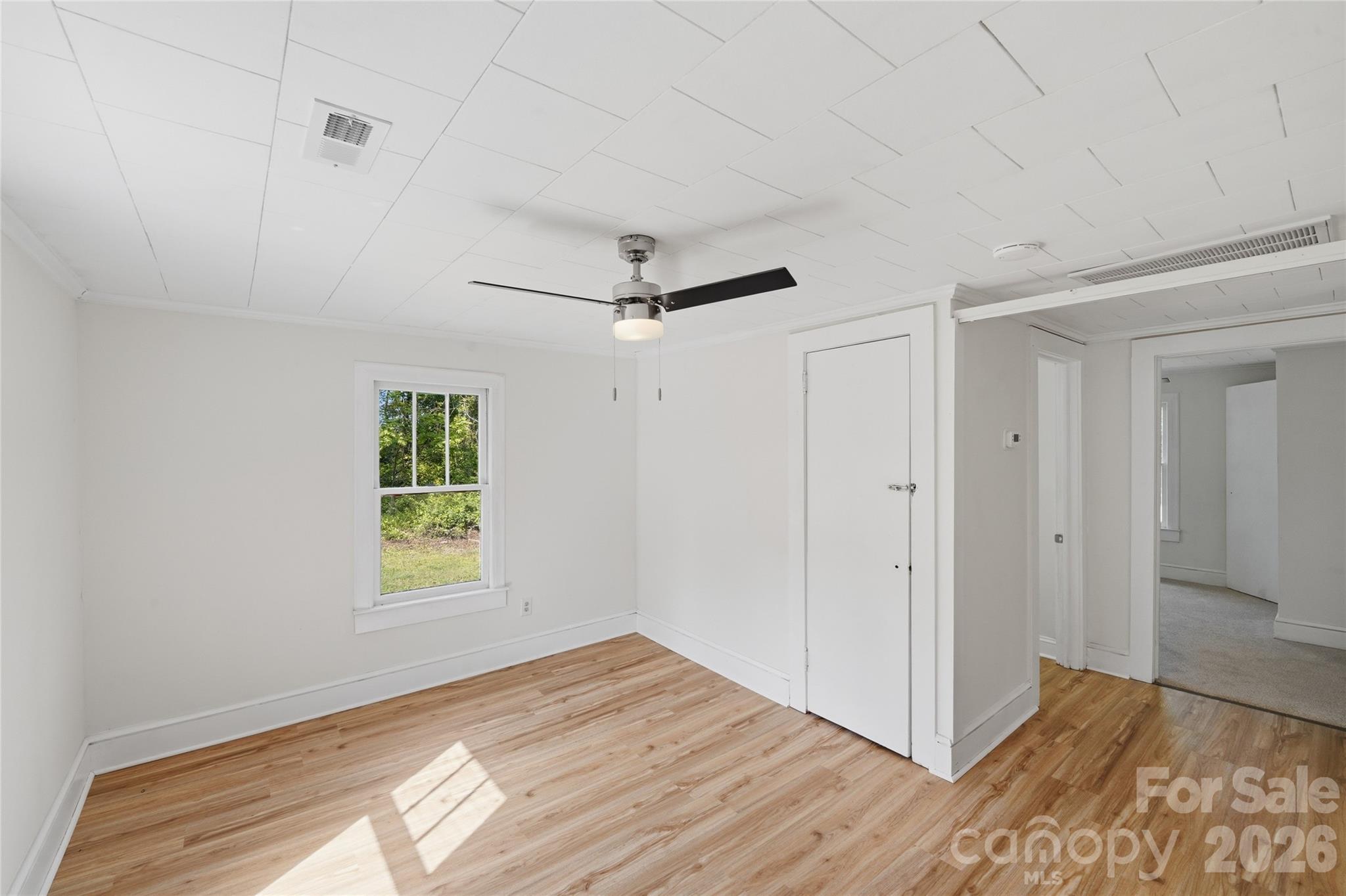 2231 Claremont Road Newton, NC 28658 - Photo 2 of 39 a view of empty room with wooden floor and fan