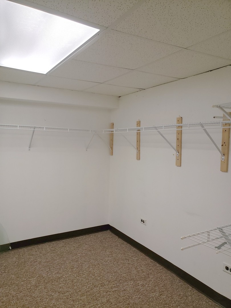 413 Harmony Drive Wheeling, IL 60090 - Photo 18 of 19 a view of a room with racks on the wall