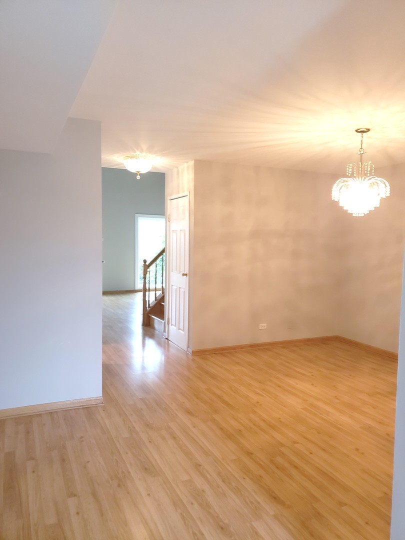 413 Harmony Drive Wheeling, IL 60090 - Photo 4 of 19 a view of empty room with wooden floor