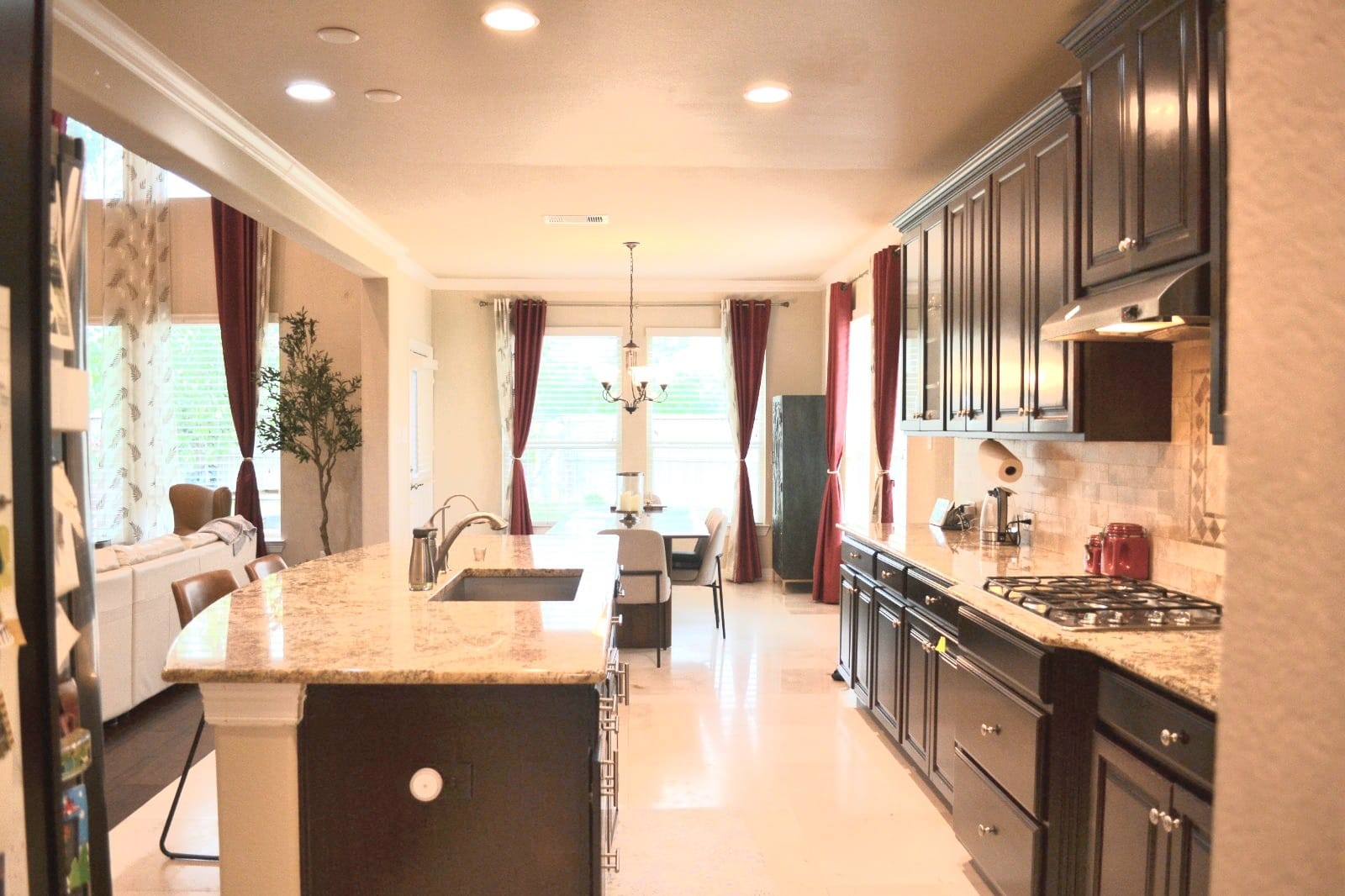 5206 Jacob Ridge Court Sugar Land, TX 77479 - Photo 22 of 42 a kitchen with stainless steel appliances kitchen island granite countertop a sink and cabinets