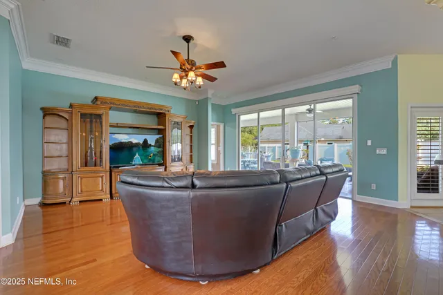 a bed room with a bed and a chandelier